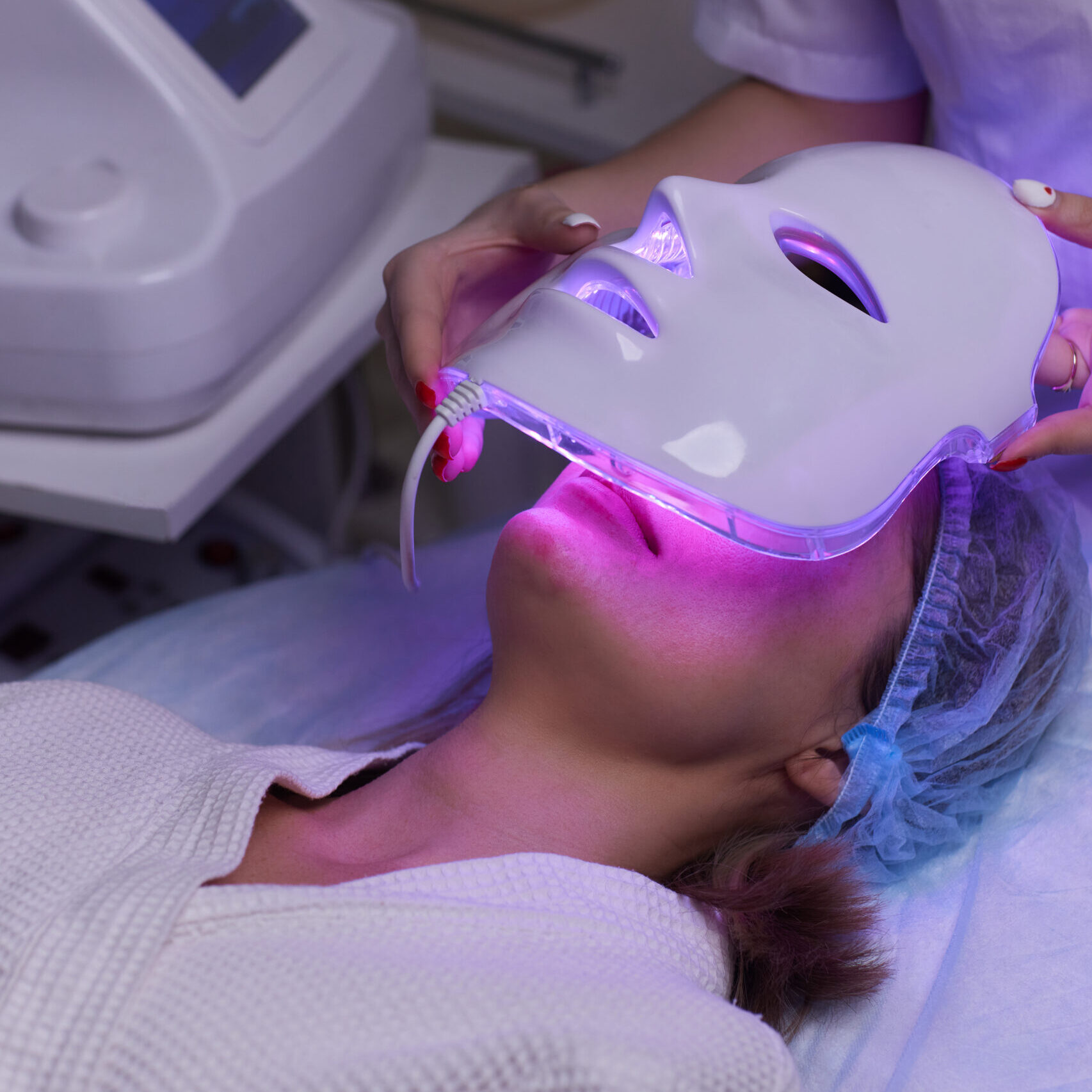 led light antiaging mask facial skin care spa slow motion woman lies couch spec scaled e1715190317972